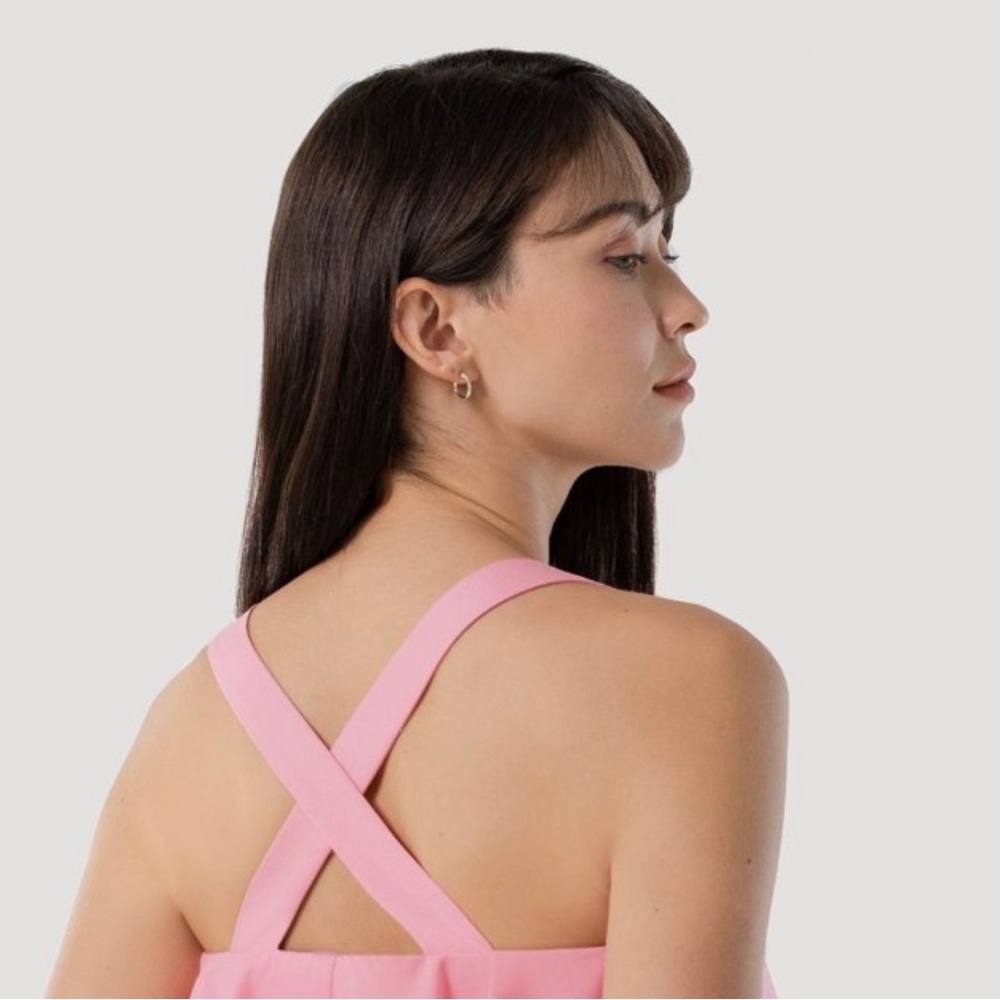 New York & Company blouse in soft pink with cross straps in back (stock photo).